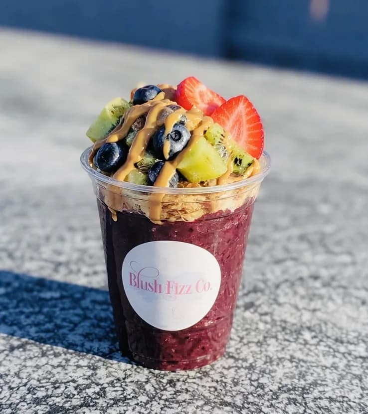 Açaí bowl cup prepared for a Blush Fizz Co. daytime event experience